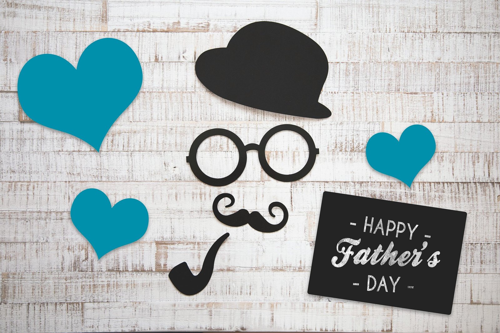 Charming Father's Day card with vintage elements on a wooden background, perfect for celebrating dads.